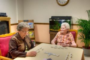 residents playing dominoes